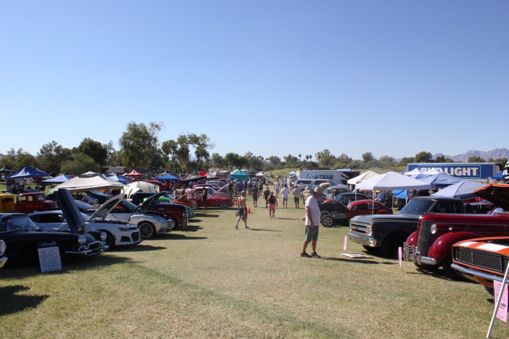 Spectators walking between rows of classic cars at Relics and Rods Run to the Sun in Lake Havasu City